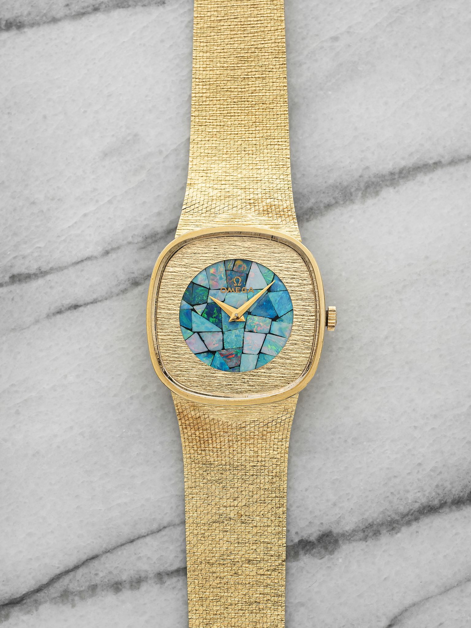 Omega - 1970s Integrated Bracelet Watch - 14K Yellow Gold Opal Mosaic Dial